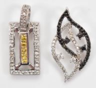 A 9ct white gold black and white gemstone pendant, with a 9ct white gold single cut diamond and