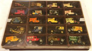 A collection of 20 matchbox diecast model vehicles in a display tray.