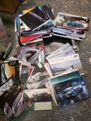 A large quantity of dealer promotional booklets, including Jaguar S-Type, Range Rover Sport, Audi