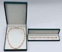 A 9ct gold clasped cultured pearl necklace, 46cm, with matching bracelet, 18cm