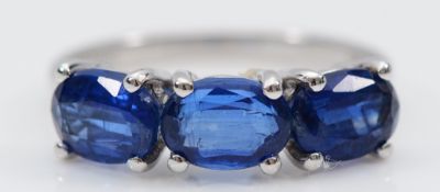 A TGGC 9ct white gold kyanite three stone ring, L, 2.5g