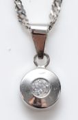 A 9ct white gold brilliant cut diamond pendant on a 9ct white gold twisted chain, approximately 0.