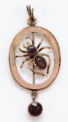 An Edwardian 9ct gold garnet spider pendant, 30mm drop, 1.5g