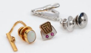 A 9ct gold opal tie pin, base metal back, front weighs 0.8g, with a 10K gold gemset tie pin, with