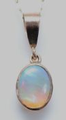 A 9ct gold opal pendant on a 9ct gold chain, 9mm x 5mm opal, 1g