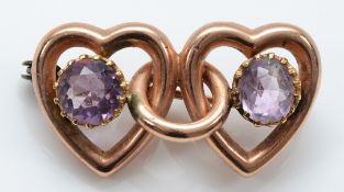 A 9ct rose gold double amethyst heart brooch, 30mm, 3.9g