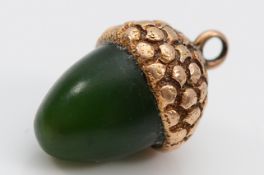 An unmarked 9ct gold nephrite acorn charm, 13mm, 2.7g