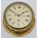 A Smiths Astral brass cased bulkhead clock, dial 14.5cm, working when catalogued.