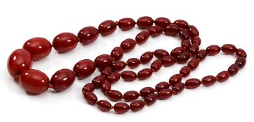 A cherry Bakelite beaded necklace, largest bead 25mm, screw closure, 87cm, 61g