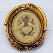 A Victorian daguerrotype brooch, swivels to reveal a carving of the Doves of Pliny, possibly