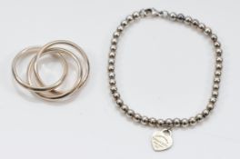 Tiffany & Co, a 925 silver beaded bracelet with green enamel heart tag, 17.5cm, with a Tiffany & Co,