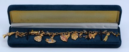 The Bradford Exchange, a 24k gold plated Disney Princess charm bracelet, with Swarovski crystals,