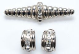 Yves Saint Laurent, a gemset brooch with matching clip on earrings
