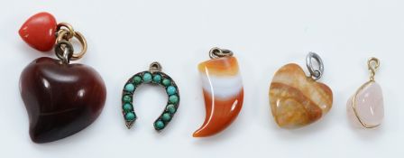 A Victorian turquoise charm, with four gemset charms to include heart shaped versions