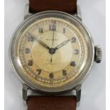 Movado, a stainless steel manual wind gentleman's wristwatch, champagne dial with Arabic numerals,