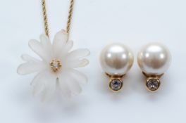 Christian Dior, a metal and acrylic flower necklace, 30mm flower, 43cm chain, with a pair of