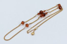 Givenchy, a gilt metal beaded necklace, 85cm