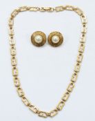 Givenchy, a gilt metal logo necklace, 47cm with a pair of Givenchy imitation pearl earrings, 25mm