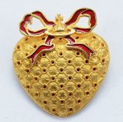 Vivienne Westwood, a gilt metal Boudoir brooch/pendant with red enamel bow around the iconic orb