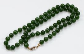 A beaded nephrite necklace, 8mm beads, 57cm
