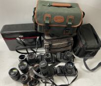 A collection of film cameras to include a Canon T50, a Cano T70, a Chinon CP-7m and others. (1 box)