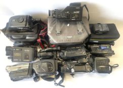 A collection of camcorders to include, a Sanyo VM-DGP, a JVC GR-AX250S and a Nikon Coolpix 995. (One