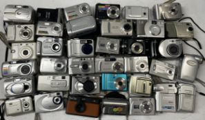 A collection of digital cameras to include, a Vivitar 9124, a Minolta DiMage 2300 and a Traveler