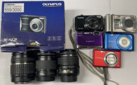 A box of digital cameras and lens to include a Panasonic Lumix DMC-ZS1, a FujiFilm FinePix Z70, an
