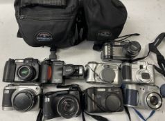 A collection of digital cameras to include, a Yakumo 55ex, a Casio QV-4000 and a HP Photosmart