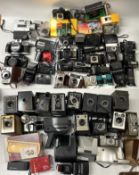 2 boxes of film cameras to include movie cameras, box cameras, Kodak Instamatics, accessories and