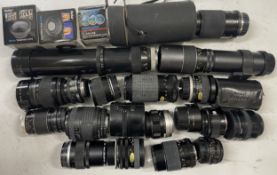 A box of camera lens to include a Miranda 1:4.5-5.6 lens, a Nikon AF Nikkor 28-80mm lens, a