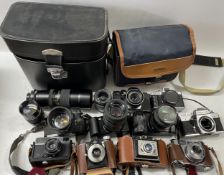 A collection of film cameras to include a Ricoh Auto TLS EE, a Revue ML, a Canon EOS 500 and others.