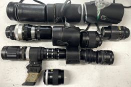 A box of camera lens to include a Nikkor-Q Auto 1:4 200mm lens, a Hanimex 300mm 1:5.6 mirror lens, a