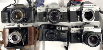 6 film cameras to include a Praktica MTL B camera with a 50mm lens, a Canon T50 with a 50mm lens,