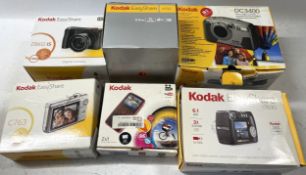A collection of boxed digital cameras to include, a Kodak Zx1, a Kodak Easy Share V550 and a Kodak