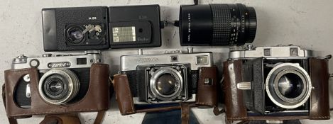 4 film cameras to include a Voigtlander Vitessa, a Rollei A26, a Solida III, a Zorki 6 and a Carl