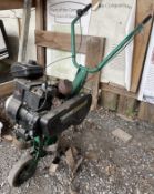 A Qualcast Cultimatic B66 small petrol rotovator.