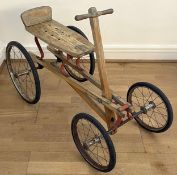 A mid twentieth century child's hand powered rolling cart utilising a push-pull mechanism