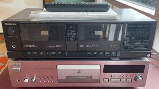 A Sony CDP-XB930 compact disc player and a Technics RS-T11 stereo double cassette deck. (2)