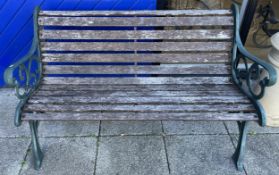 A garden bench, cast iron ends with timber slats, width 129cm, height 78cm.