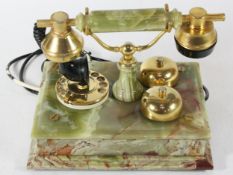 A 1970s Italian onyx and brass rotary telephone, influenced by the Hollywood Regency revival