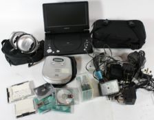 A collection of electronics to include various chargers and cables, a Goodmans CD player, a