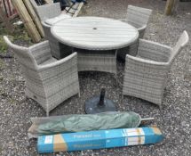 A garden patio dining set made by Lifestyle Garden, large round table with four chairs in