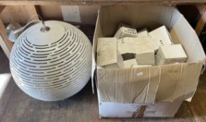 A large spherical light fitting and a box containing a large quantity of boxed light fittings. (2)