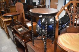 An early 20th Century oak occasional table having oval top and twist frame, approx. 61 x 46cm