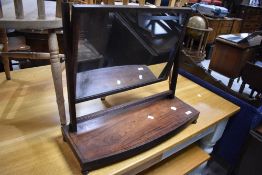 A 19th Century mahogany toilet mirror having platform base, width approx. 63cm