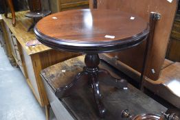 A reproduction mahogany effect circular coffee table on quadruple legs, diameter approx. 60cm