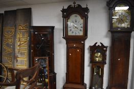 A 19th Century oak and mahogany long cased clock having eight day movement and painted dial named