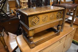 A vintage oak box stool, width 56cm