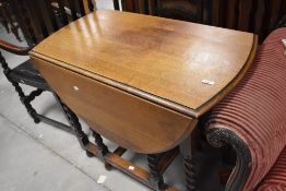 An early 20th Century oak twist gateleg table, width approx. 91cm